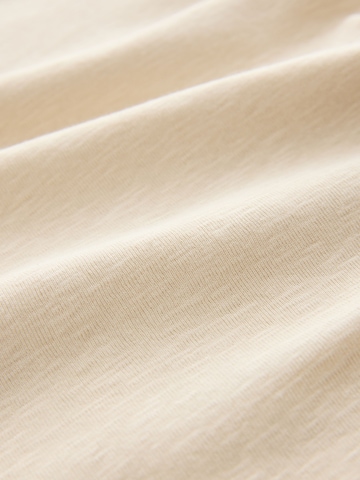 Tricou de la Next pe bej