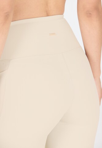 Athlecia Regular Workout Pants 'Aliya' in Beige