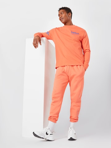 ABOUT YOU x Mero - Camiseta 'Kelkid' en naranja