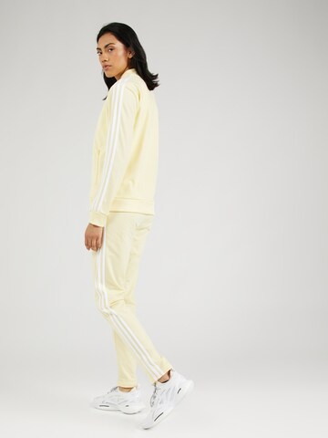 dzeltens ADIDAS SPORTSWEAR Treniņtērps 'Essentials'