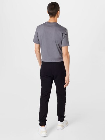 Champion Authentic Athletic Apparel Tapered Broek in Zwart