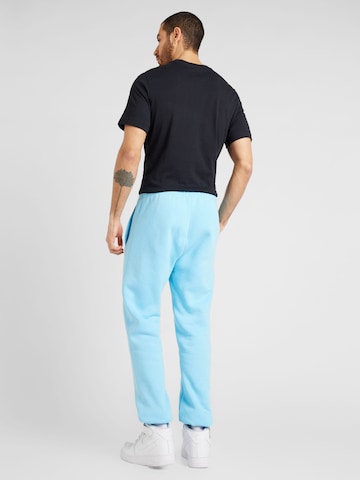 Nike Sportswear Zwężany krój Spodnie 'CLUB FLEECE' w kolorze niebieski