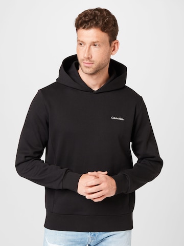 Sweat-shirt Calvin Klein en noir : devant