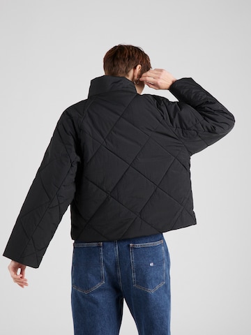 Tommy Jeans Zimska jakna | črna barva