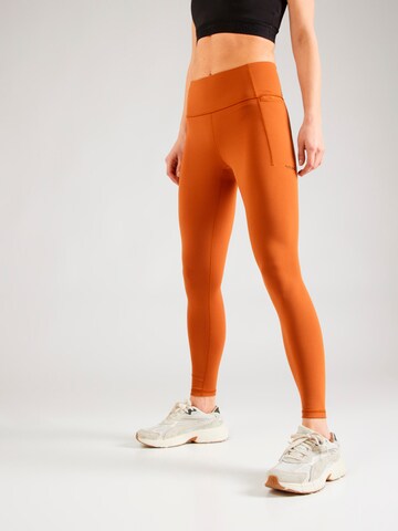 PUMA Skinny Workout Pants in Brown: front