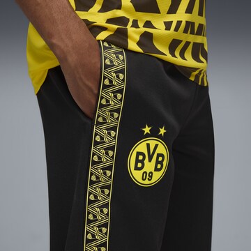 Effilé Pantalon de sport 'Borussia Dortmund KING Anthem' PUMA en noir