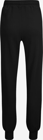 FILA Lużny krój Spodnie sportowe 'BUETZOW' w kolorze czarny