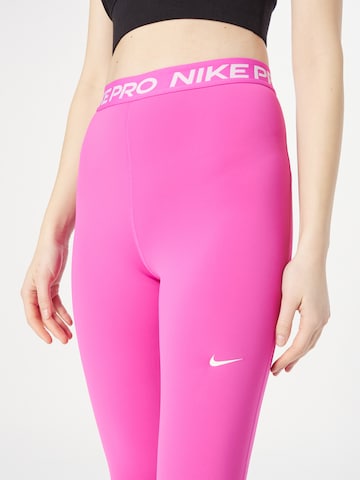 Skinny Pantaloni sport de la NIKE pe roz
