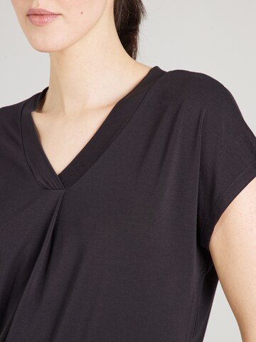 Maglia funzionale di CURARE Yogawear in nero