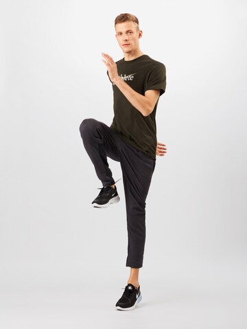 NIKERegular Fit Tehnička sportska majica 'Athlete' - zelena boja