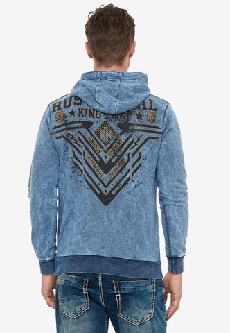 Rusty Neal Sweatshirt mit Oil Washed Front Print in Blau