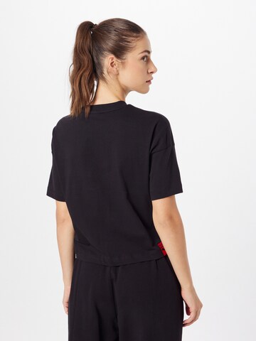 PUMA Performance Shirt 'PUMA x Vogue Collection' in Black