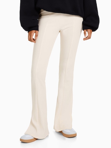 Bershka Flared Pants in Beige: front