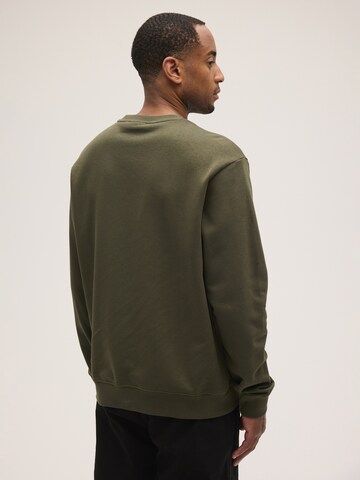 FILA Sweatshirt 'COREDO relaxed varsity brushed sweatshirt' in Groen