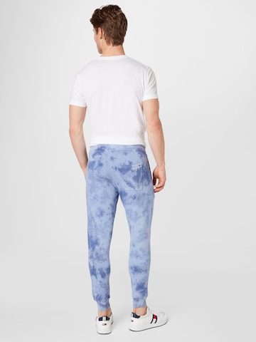 Tommy Jeans Zwężany krój Spodnie w kolorze niebieski