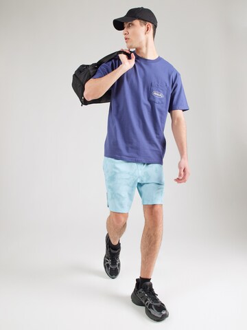 BILLABONG - Camiseta funcional 'BAD DOG' en azul