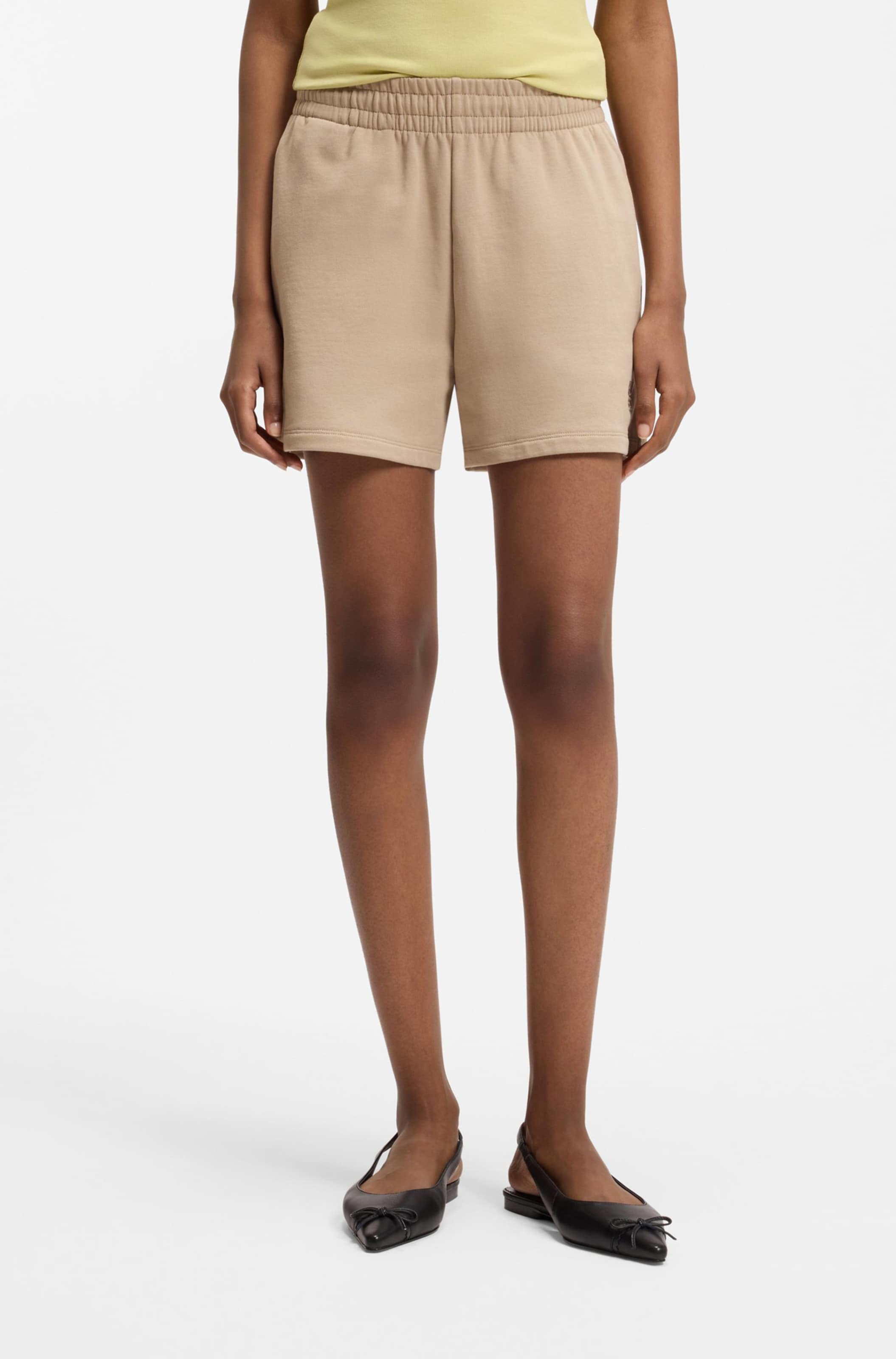 HUGO Loose fit Pants 'Ninosta' in Brown: front