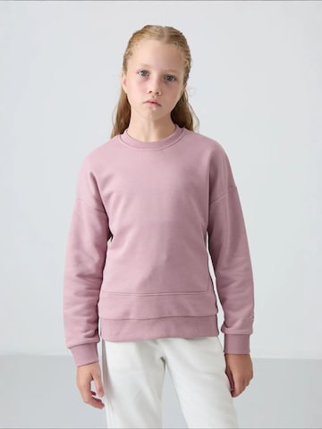 Tommy Life Bluzka sportowa 'TOMMY Jugend-Unisex-Sweatshirt Aus Baumwollmischung' w kolorze zielony