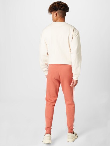 ADIDAS ORIGINALS Tapered Trousers 'Adicolor Classics 3-Stripes' in Pink
