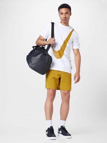 NIKE Štandardný strih Športové nohavice 'Unlimited' - Žltá