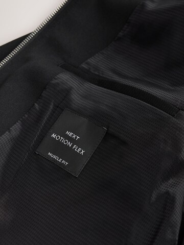 Next - Chaqueta de entretiempo 'Motionflex' en negro