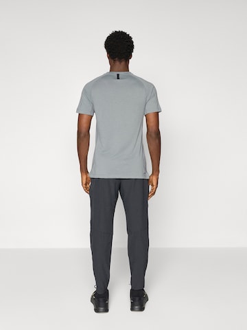 NIKE Alt kitsenev Spordipüksid 'Pro', värv must