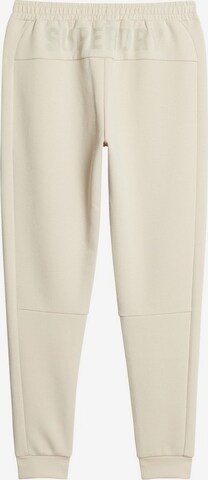 Coupe slim Pantalon de sport Superdry en beige