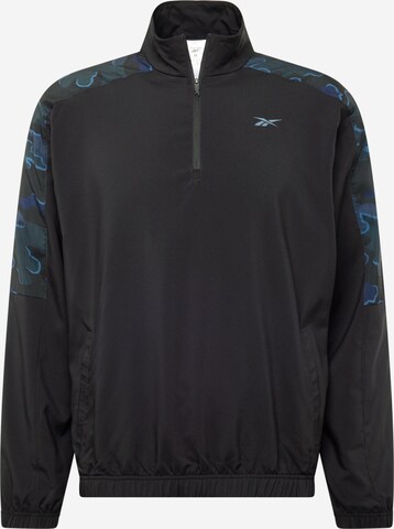 Reebok Sportsweatshirt 'TRAIN MOTION' in Zwart: voorkant