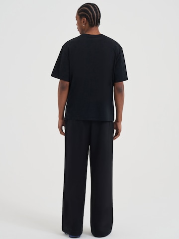 AND1 Široke hlačnice Hlače | črna barva