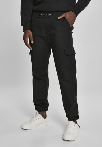 Urban Classics Regular Cargo trousers in Black: front