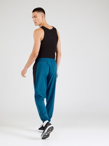 Reebok Zúžený Sportovní kalhoty – modrá