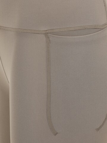 UNDER ARMOUR Skinny Spodnie sportowe 'Meridian' w kolorze beżowy