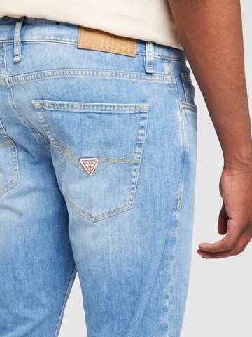 GUESS Tapered Jeans i blå