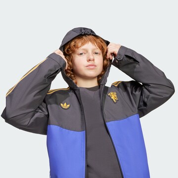 Veste mi-saison 'Manchester United Terrace Icons' ADIDAS ORIGINALS en noir