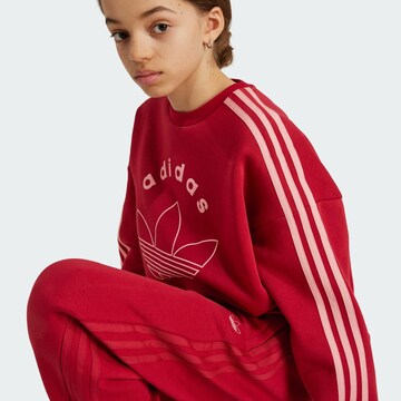 ADIDAS ORIGINALS Tapered Trousers in Red