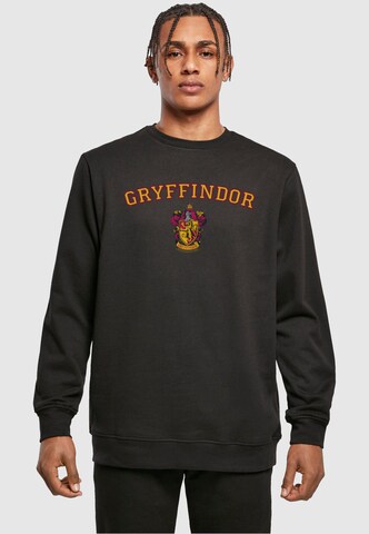 Sweat-shirt 'Harry Potter - Hogwarts Gryffindor Crest' ABSOLUTE CULT en noir : devant