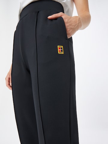 Effilé Pantalon de sport 'Heritage' NIKE en noir