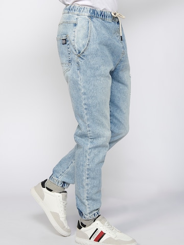 KOROSHI Tapered Jeans i blå