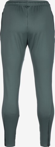 NIKE Slim fit Workout Pants in Green