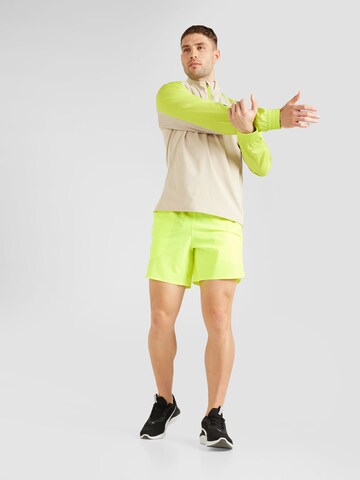 regular Pantaloni sportivi 'Peak' di UNDER ARMOUR in giallo