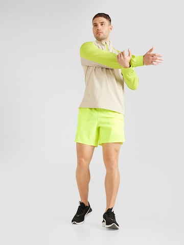 UNDER ARMOUR Regular Sports trousers 'Peak' in Yellow