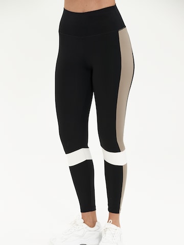 Athlecia Skinny Urheiluhousut 'Comaya' värissä musta: etupuoli