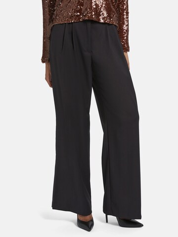 Nicowa Slimfit Anzughose 'ROSCIWO', weites Bein, Bundfalten, Model trägt Größe 34 in Braun: Vorderseite