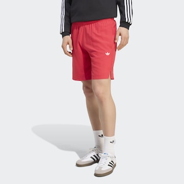 ADIDAS ORIGINALS Regular Pants in Orange: front
