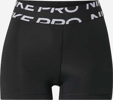 Skinny Pantaloni sport de la NIKE pe negru: față