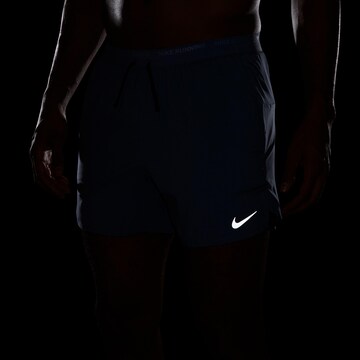 NIKE Regular Workout Pants 'Flex Stride' in Blue