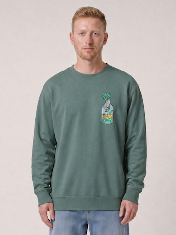 Watapparel Sweatshirt 'Holiday In A Bottle' in Groen: voorkant