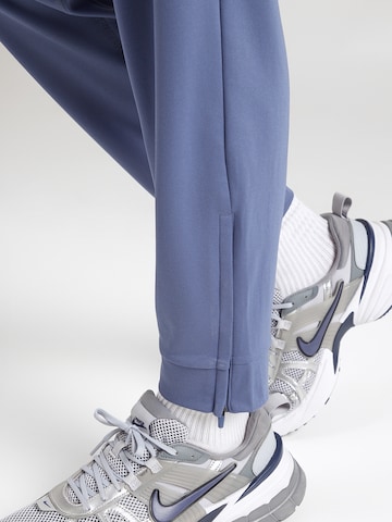 Effilé Pantalon de sport 'TOTALITY' NIKE en bleu
