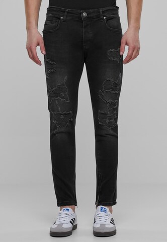 Skinny Jeans di Karl Kani in nero