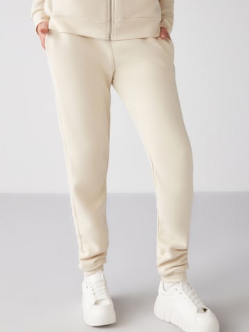 Grimelange Zúžený strih Nohavice - Béžová: predná strana